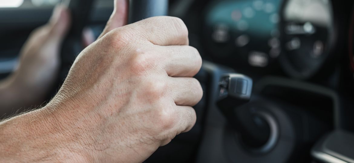 Male Driver Holding On To Steering Wheel Of Car And Operating Ve (Demo)